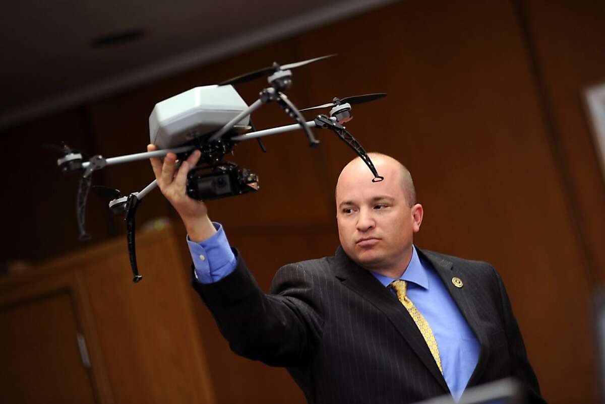 An Alameda Sheriffs Deputy holds a drone similar to the ones the departement is looking to purchase. The Alameda County Board of Supervisors listened to arguments from the sheriff's department and the ACLU on the issue of Alameda County becoming the first county in California to use unmanned drones for police work, at the Alameda County Administration Building in Oakland, CA Wednesday February 14th, 2013