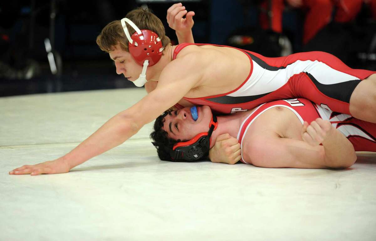 Fairfield Prep's Conor Ward pins Masuk's Doug Katz as they compete in the 152 lb. weight class during their wrestling meet Saturday, Jan. 26, 2013 at Staples High School in Westport, Conn.