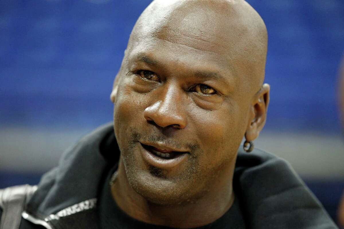 Charlotte Bobcats owner Michael Jordan looks on after practice at NBA basketball training camp in Asheville, N.C., Tuesday, Oct. 2, 2012. (AP Photo/Chuck Burton)