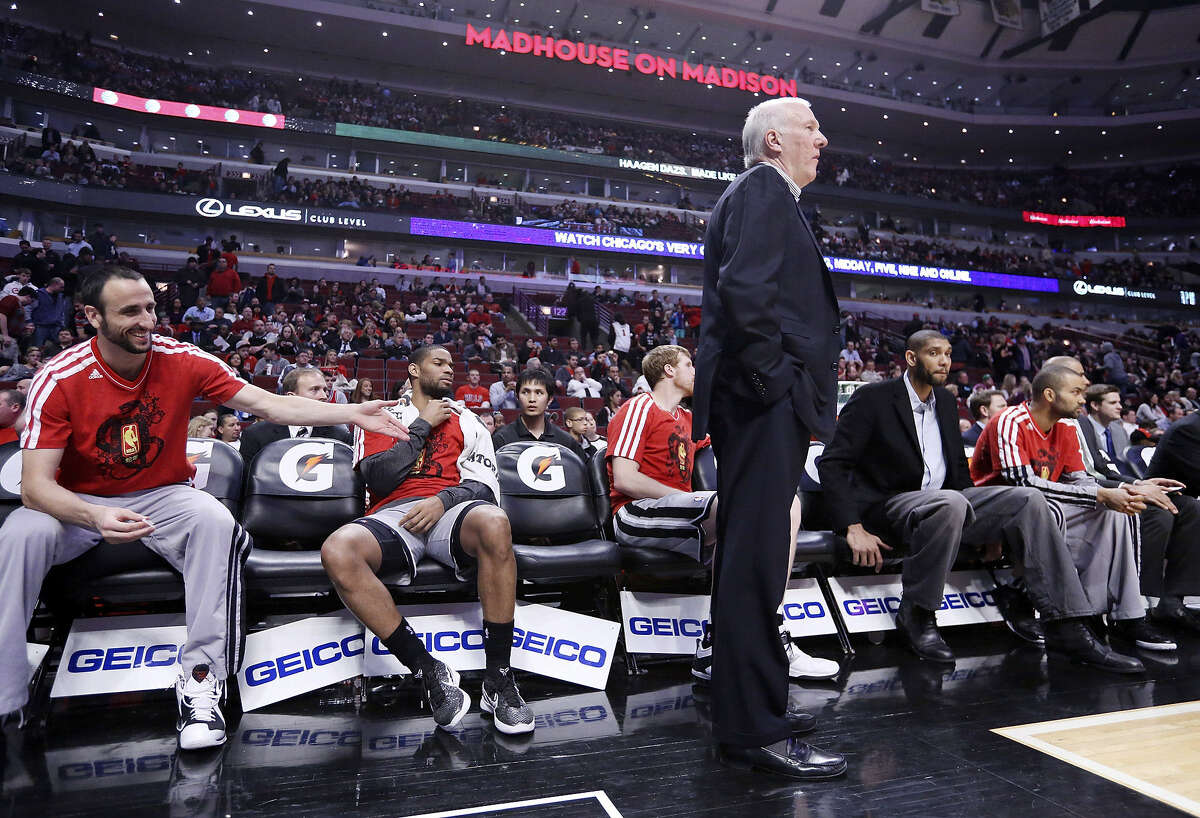 The Spurs were without Manu Ginobili (left), Tim Duncan (second from right) and Tony Parker (right) Monday in Chicago, but they still had coach Gregg Popovich, who guided his star-less squad to victory anyway.