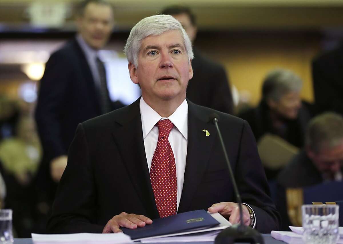 Michigan Gov. Rick Snyder presents his third state budget before the state Legislature in Lansing, Mich., Thursday, Feb. 7, 2013. The governor proposed a $50.9 billion budget that would raise state gas taxes and vehicle fees, expand Medicaid to more uninsured adults and double the number of 4-year-olds in a preschool program for at-risk kids. (AP Photo/Carlos Osorio)