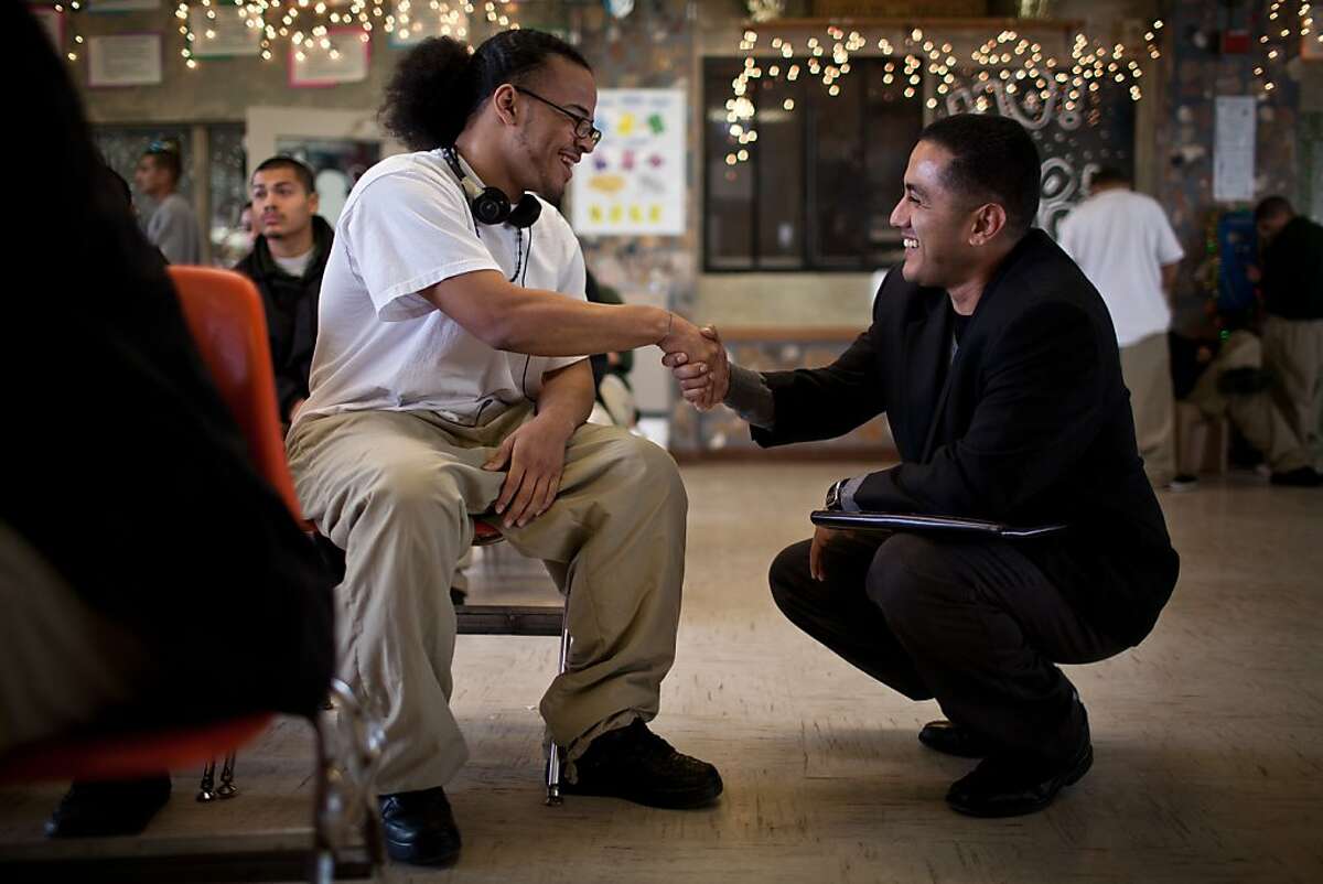Soros Justice Fellow Frankie Guzman, right, talks with inmate Chad Scott at the O.H. Close Youth Correctional Facility in Stockton, Calif., December 21, 2012.