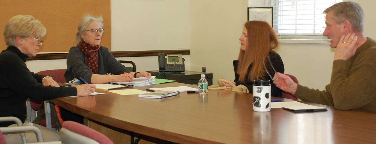 Discussing ways to generate public participation in Tree Board programs are, from left, board members Judy James, Chairwoman Pamela Klomberg and Tracey Hammer, with John Broadbin, the town's deputy public works director. WESTPORT NEWS, CT 2/15/13