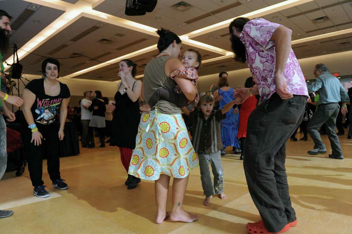 Gretchen Terrell holds her daughter Minka while her husband Davis Terrell and son Wilder dance as a family during a Cajun dance party as part of Dance Flurry on Saturday Feb. 16, 2013 in Saratoga Springs, N.Y. .(Michael P. Farrell/Times Union)