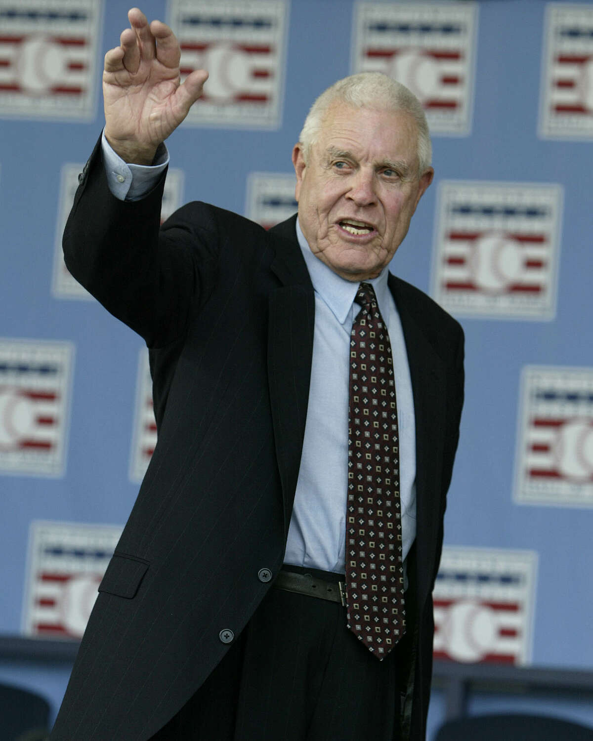 Broadcaster Lon Simmons, the longtime voice of baseball in the San Francisco Bay area, waves at the end of the 2004 National Baseball Hall of Fame induction ceremonies Sunday, July 25, 2004 in Cooperstown, N.Y. Simmons is the recipient of the Ford C. Frick Award given annually to a baseball broadcaster. (AP Photo/John Dunn) Ran on: 07-26-2004 Photo caption Dummy text goes here. Dummy text goes here. Dummy text goes here. Dummy text goes here. Dummy text goes here. Dummy text goes here.Dummy text goes here. Dummy text goes here. Ran on: 07-26-2004 ProductNameChronicle