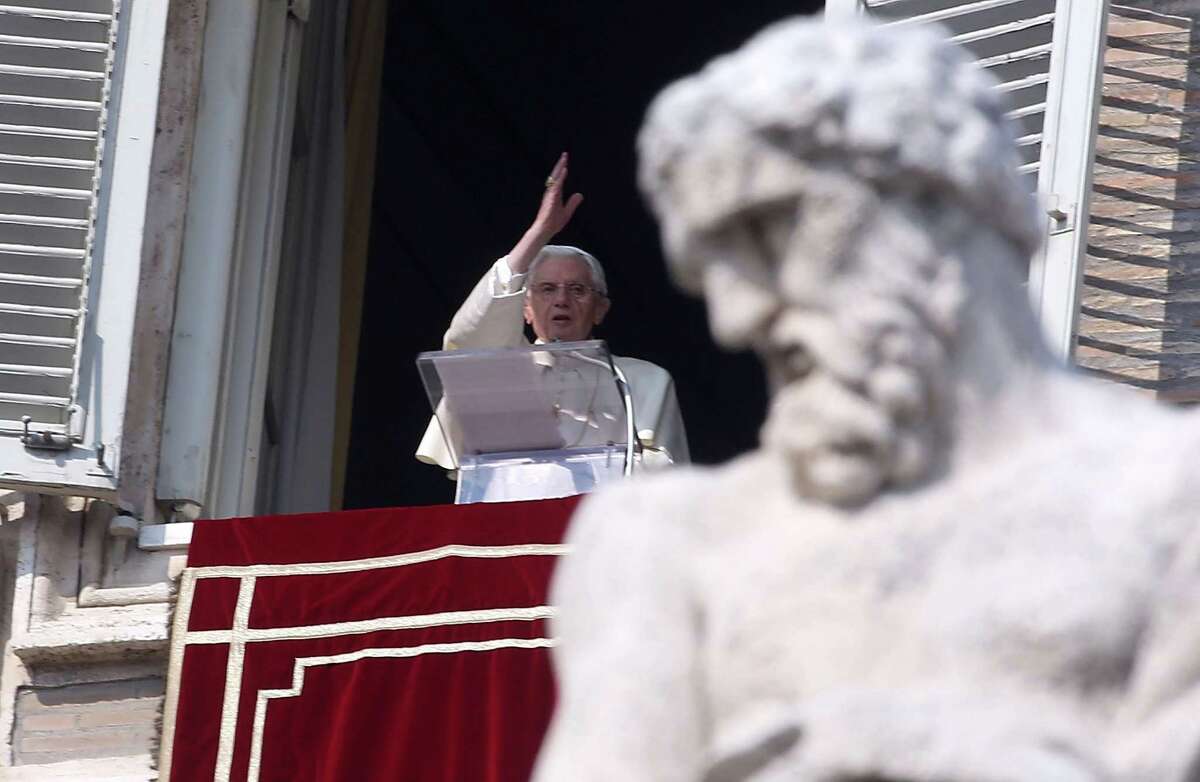 Pope Benedict XVI delivers a blessing to the upward of 100,000 faithful who flocked to St. Peter's Square on Sunday for one of his final appearances as pontiff.