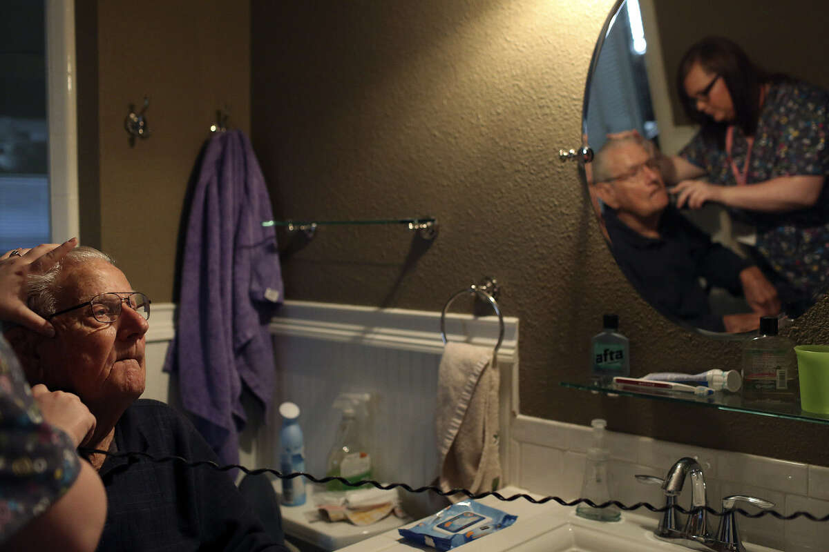 Kayla Hester, a caregiver with Nurse Next Door home health care, shaves George Roeber, 92, before helping him with his shower at his home in San Antonio. Home health care is expected to be a fast-growing field as baby boomers age.