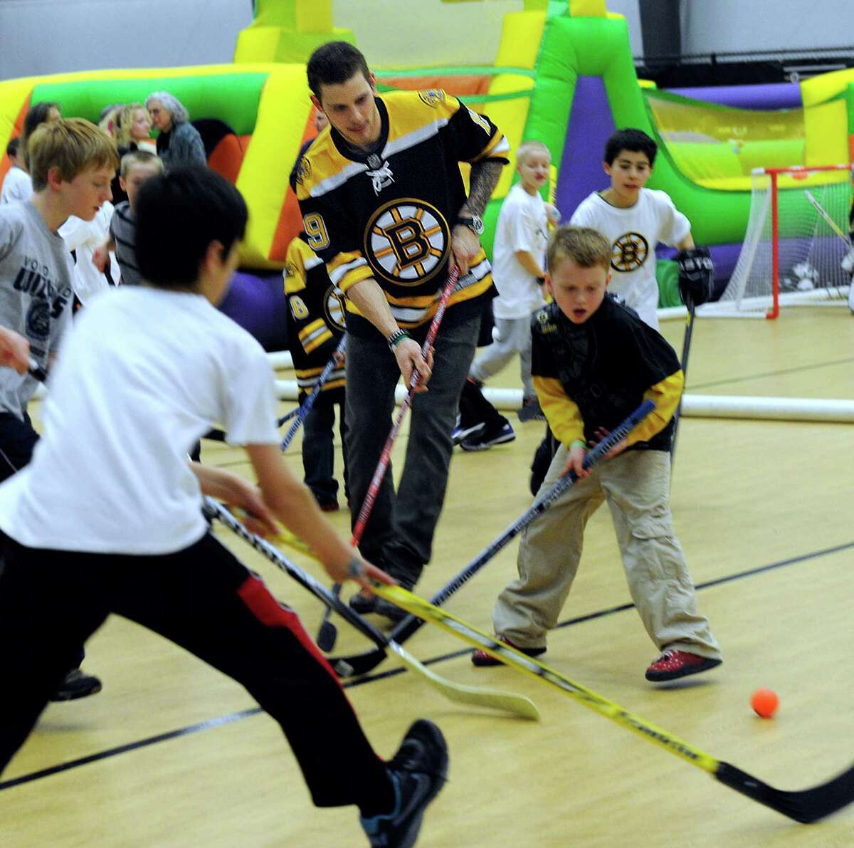 Boston Bruin player, Tyler Seguin, participates in a hockey clinic for Newtown kids at the Newtown Youth Academy, Monday, Feb. 18, 2013.