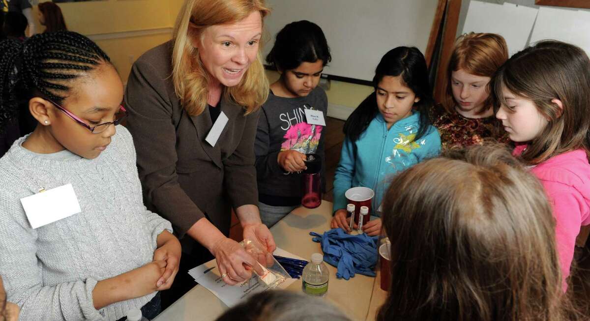 Girls experiment with chromatography during a lunch and learn session with Lynda Fredette, second from left, at SoundWaters in Stamford on Tuesday, February 19, 2013.