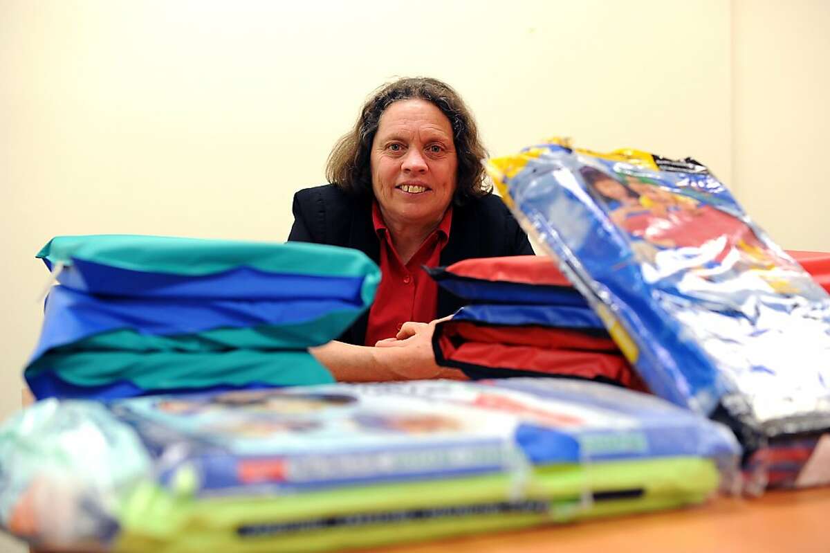 Research director Caroline Cox is photographed with sleep mats that contain toxic flame retardants at the Center for Environmental Health in Oakland, CA Tuesday February 19th, 2013. The Center for Environmental Health announced it has filed lawsuits against major companies, including Target.com, Amazon.com and Sears.com, for selling nap mats that contain toxic flame retardants and violating California consumer protection law.