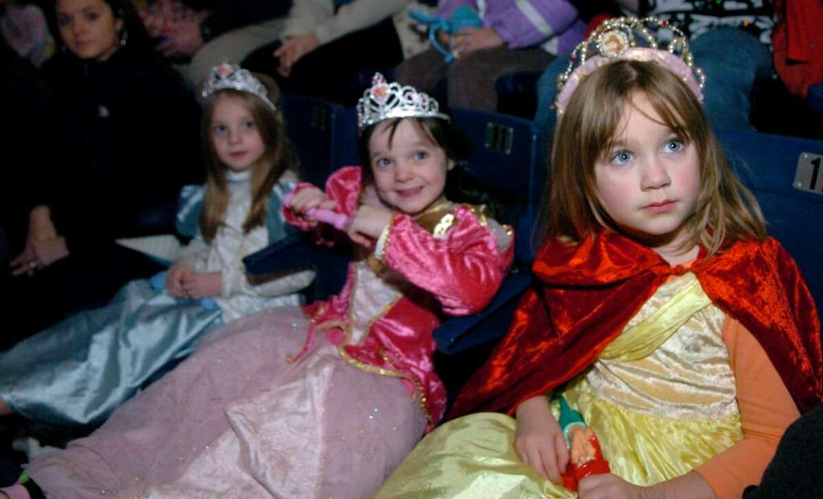 Five-year-olds, from left, Kari Boyle, Hailey Boyle and Ellie Clay, all of Milford, dress like princesses to see Disney on Ice Princess Classics Wednesday night at Bridgeport's Arena at Harbor Yard.