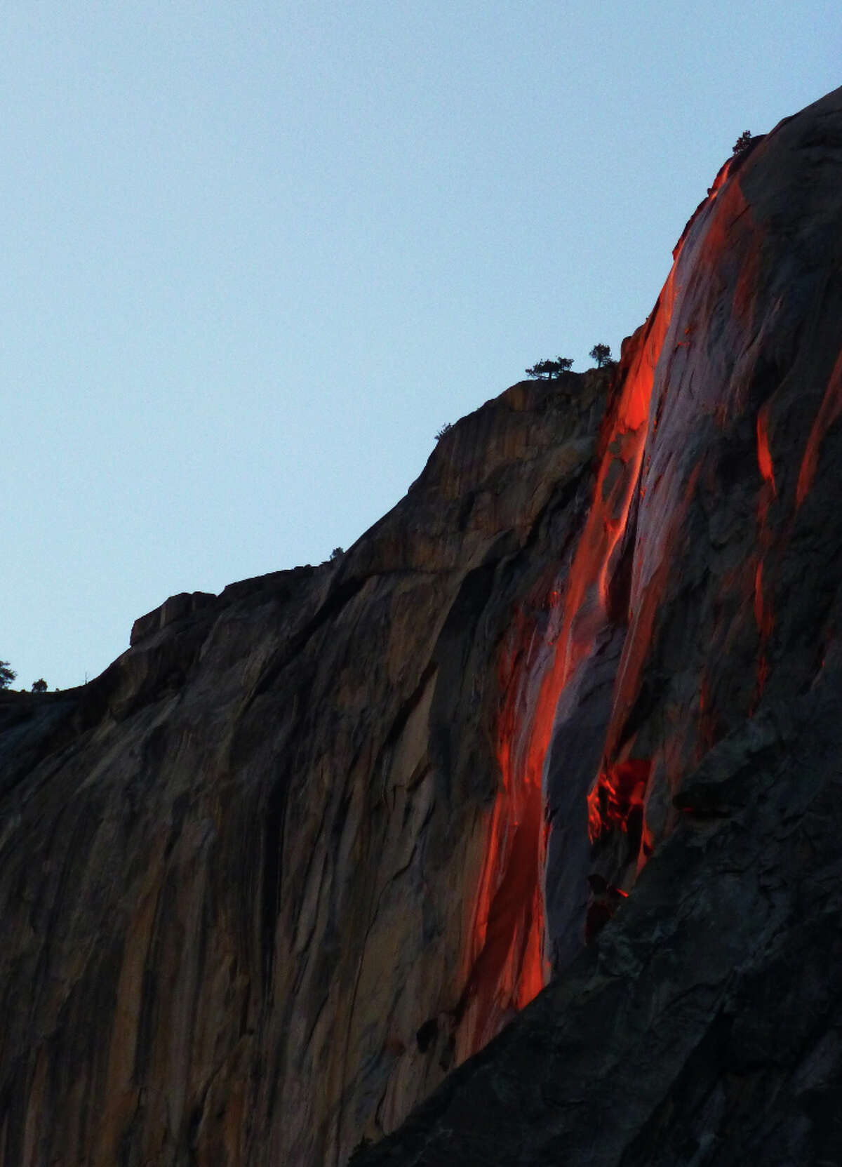 Conditions synchronized at dusk in 2013 to turn Horsetail Fall in Yosemite Valley into a firefall. This image is untouched, non Photoshopped or enhanced in any way.