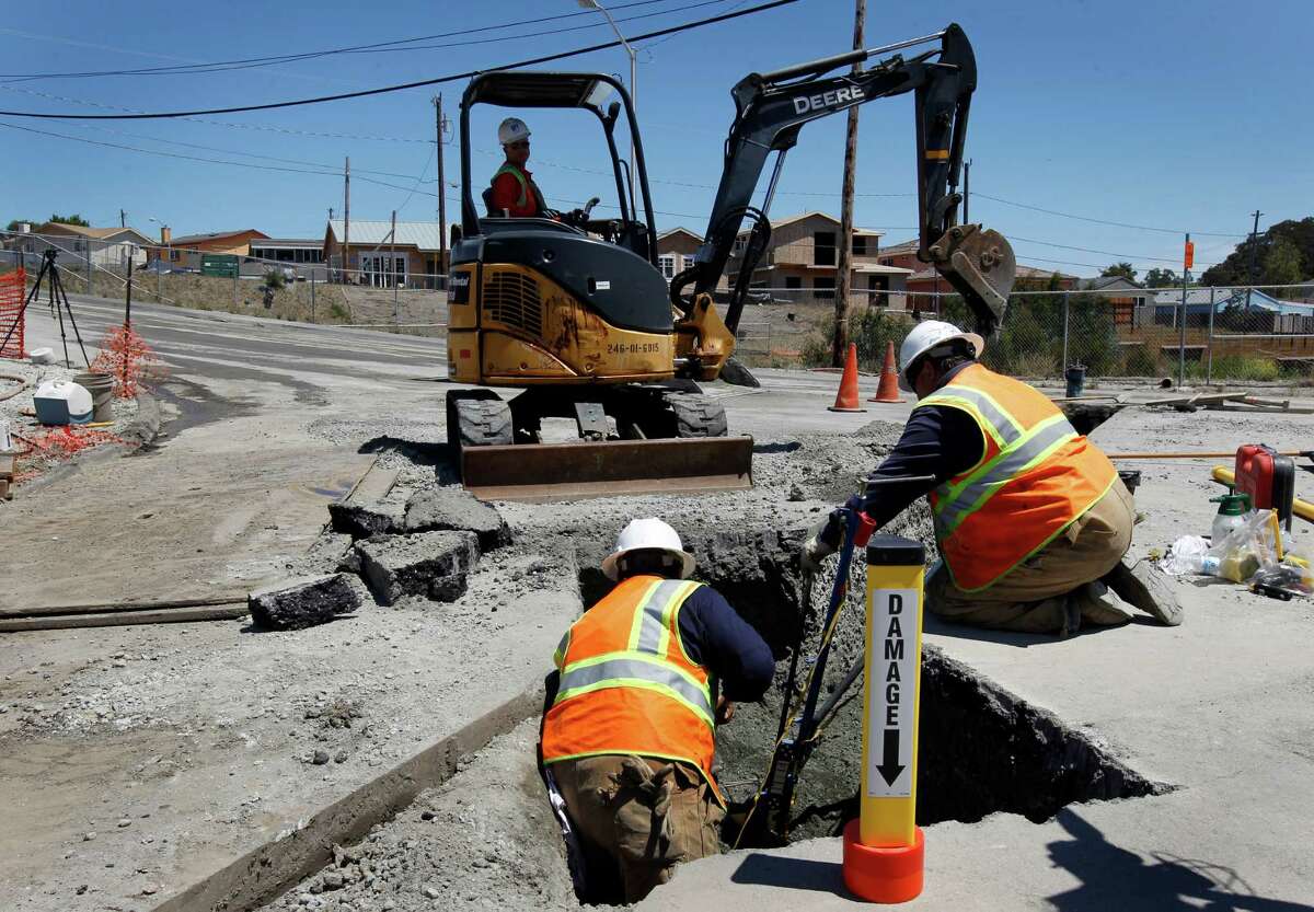 A PG&E crew replaces a 2-inch gas line in San Bruno after it was punctured by an independent contractor in 2012 digging at the exact location of the gas line explosion nearly two years ago.