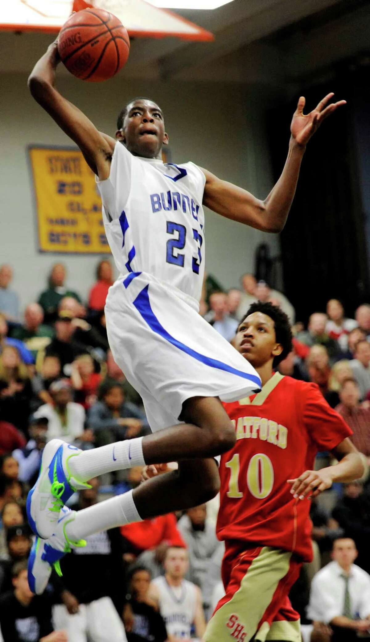 Bunnell high school's Issac Vann goes up to dunk the ball in a boys basketball game against Stratford high school played at Bunnell high school, Stratford, CT on Saturday, December 22nd, 2012.