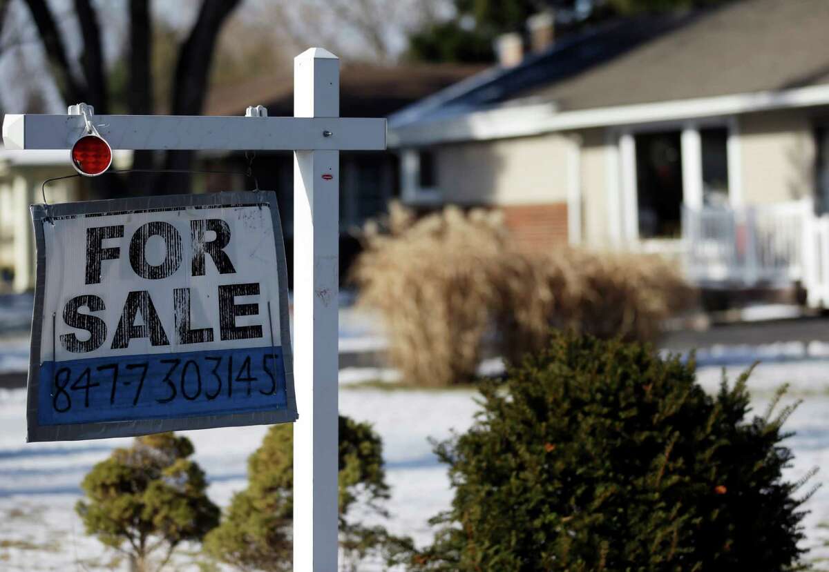 In this Jan. 5, 2013, photo a "for sale" sign is seen outside a home in Glenview, Ill. (AP Photo/Nam Y. Huh)