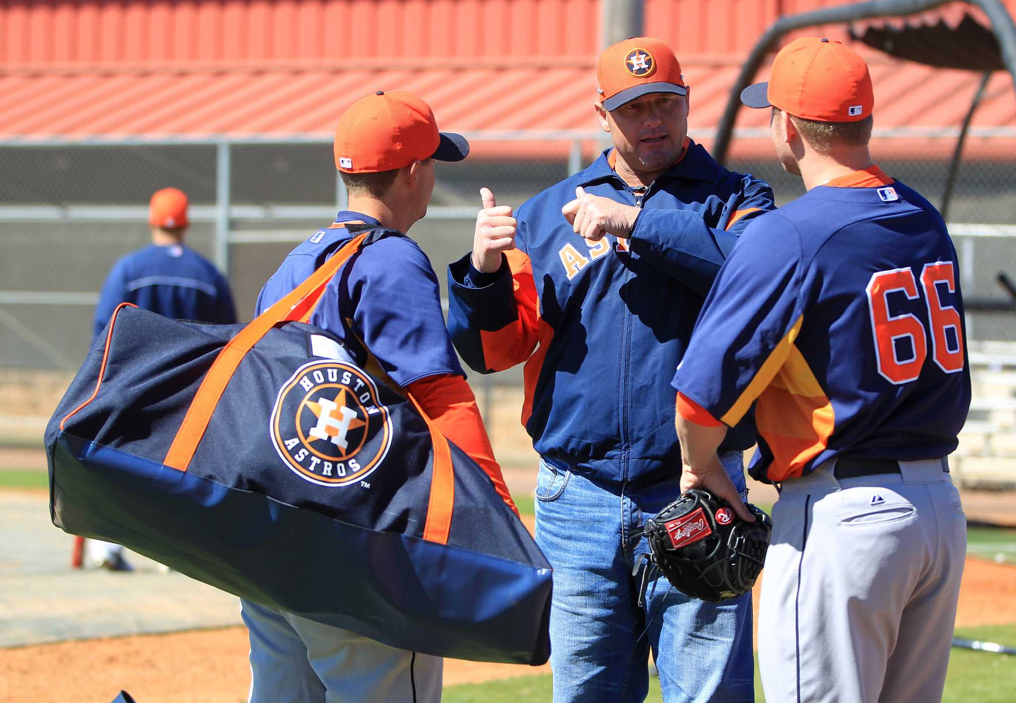 Houston Astros' Carlos Pena, right, and Carlos Corporan (22) are