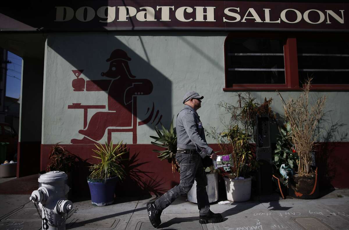 James Ellis of San Francisco walks past the Dogpatch Saloon on his way to work in the Dogpatch neighborhood on Friday, February 22, 2013 in San Francisco, Calif.