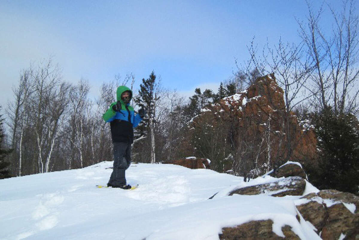 Shane Bush Lancaster, 12, of Minerva stands atop the Garnet mine tailing Thursday, Feb. 21 , 2013, at the Garnet Hill Cross County Ski Center in North River, N.Y. (Rick Karlin/Times Union)