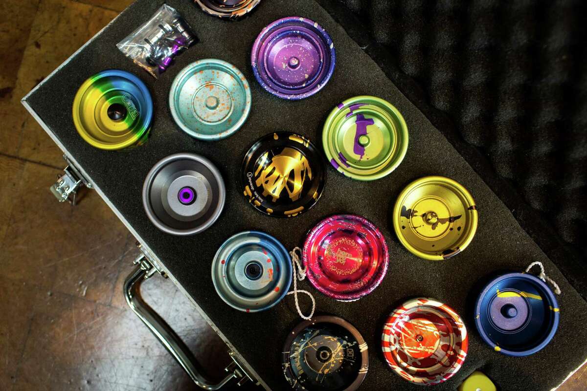 A colorful variety of high-performance yo-yos sit on display in a traveler's case.