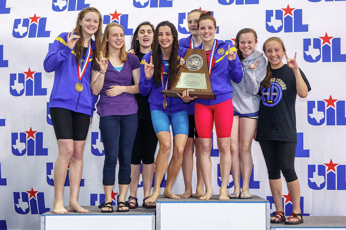 The Alamo Heights girls swim team celebrates on the podium with their state runner-up trophy at the the finals of the 4A UIL Swimming & Diving State Meet at the Jamail Texas Swim Center in Austin on Saturday, Feb 23, 2013. MARVIN PFEIFFER/ mpfeiffer@express-news.net