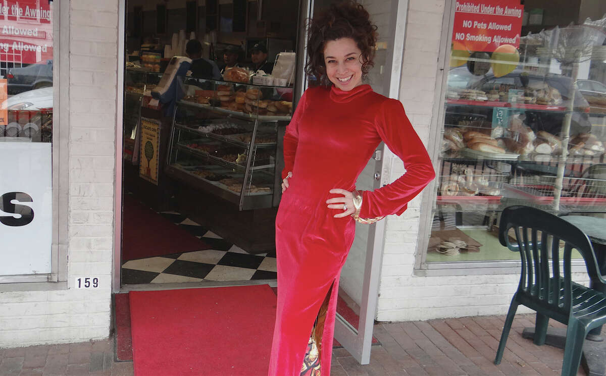 Susie Mastropietro models her "red carpet dress" on a mock red carpet at Oscar's Deli, where the 2nd annual n'Oscars Party was held Sunday. WESTPORT NEWS, CT 2/24/13