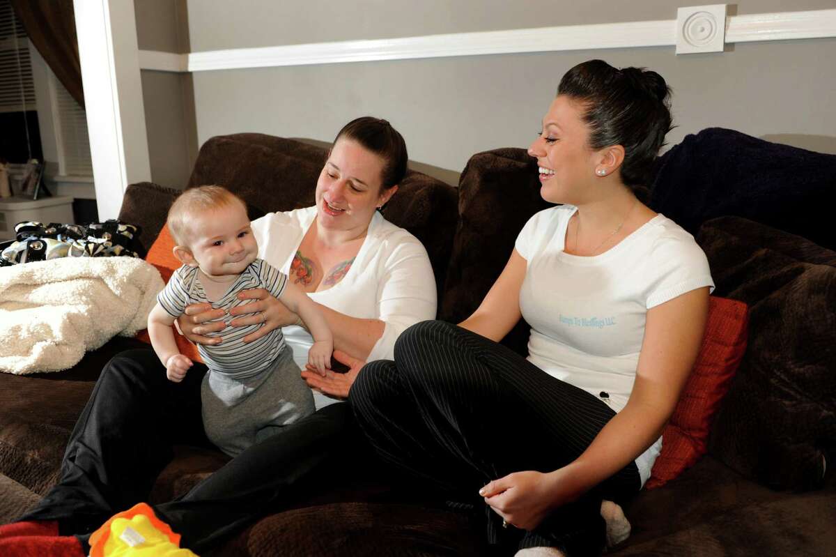 Chelsea Prisco, maternity coach and consultant, right, with client Devon Votto of Albany and her 5-month-old son Caiden on Friday, Feb. 15, 2013, at Prisco's home in Schenectady, N.Y. (Cindy Schultz / Times Union)
