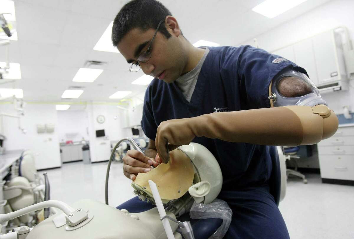 Dental student adapts to prosthetic arm