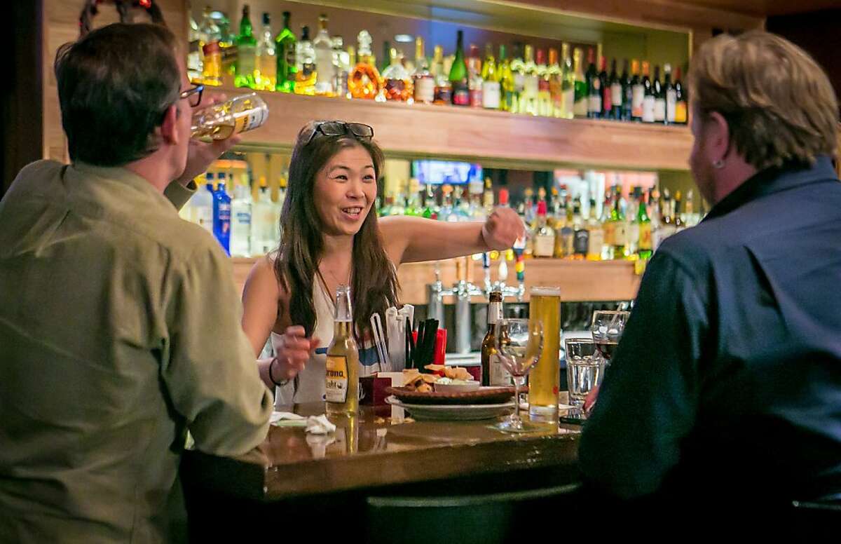 Bartender Pui Viwattanasakpol helps customers at Coconut Bay Restaurant in Burlingame, Calif. on Friday, February 15th, 2013.