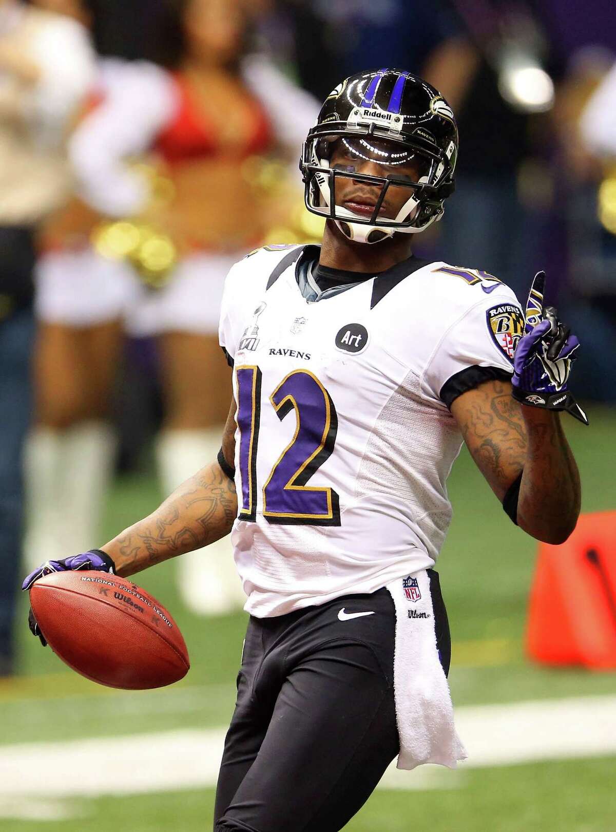 Baltimore Ravens wide receiver Jacoby Jones takes a kickoff the