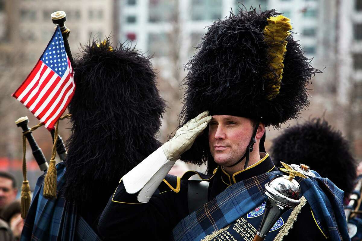 NEW YORK, NY - FEBRUARY 26: A member of the Port Authority Pipes and Drums band stands at attention during the 20th Anniversary Ceremony for the 1993 World Trade Center bombing at Ground Zero on February 26, 2013 in New York City. The attack, which utilized a car bomb and hit the north tower, killed six people.