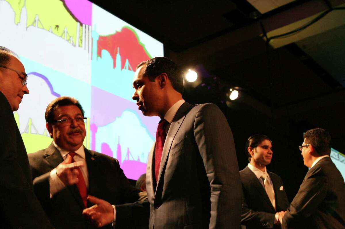 San Antonio Mayor Julián Castro speaks on Feb. 26, 2013, with Hispanic Chamber of Commerce president and CEO Ramiro Cavazos (left) and Hispanic Chamber of Commerce chairman of the board Alex Briseno after Castro presented his annual State of the City address at the Henry B. Gonzalez Convention Center in San Antonio.