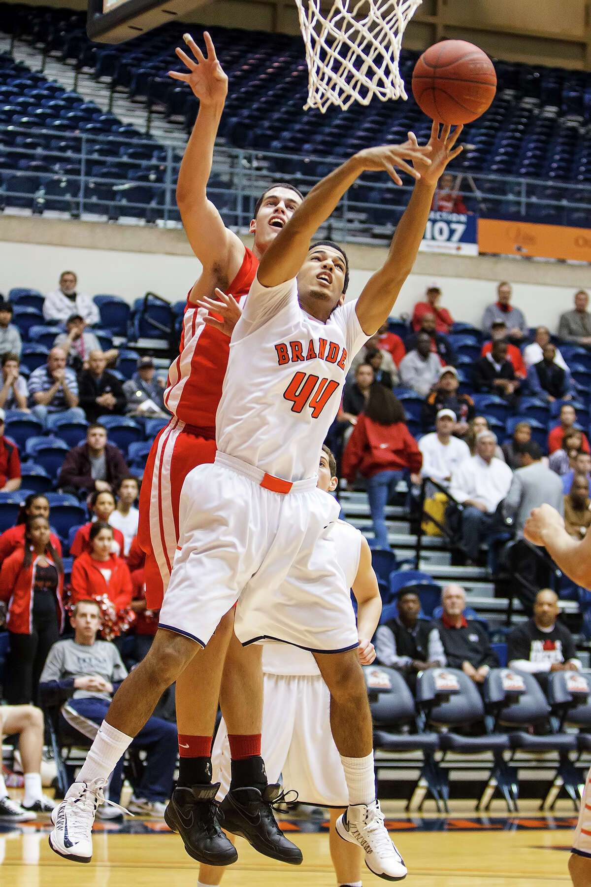 Brandeis' Jonathan Robinson (right) battles Judson's David Wacker for a rebound during the first half of their Class 5A boys basketball third round game at the UTSA Convocation Center on Tuesday, Feb. 26, 2013. Brandeis won the game 60-53.