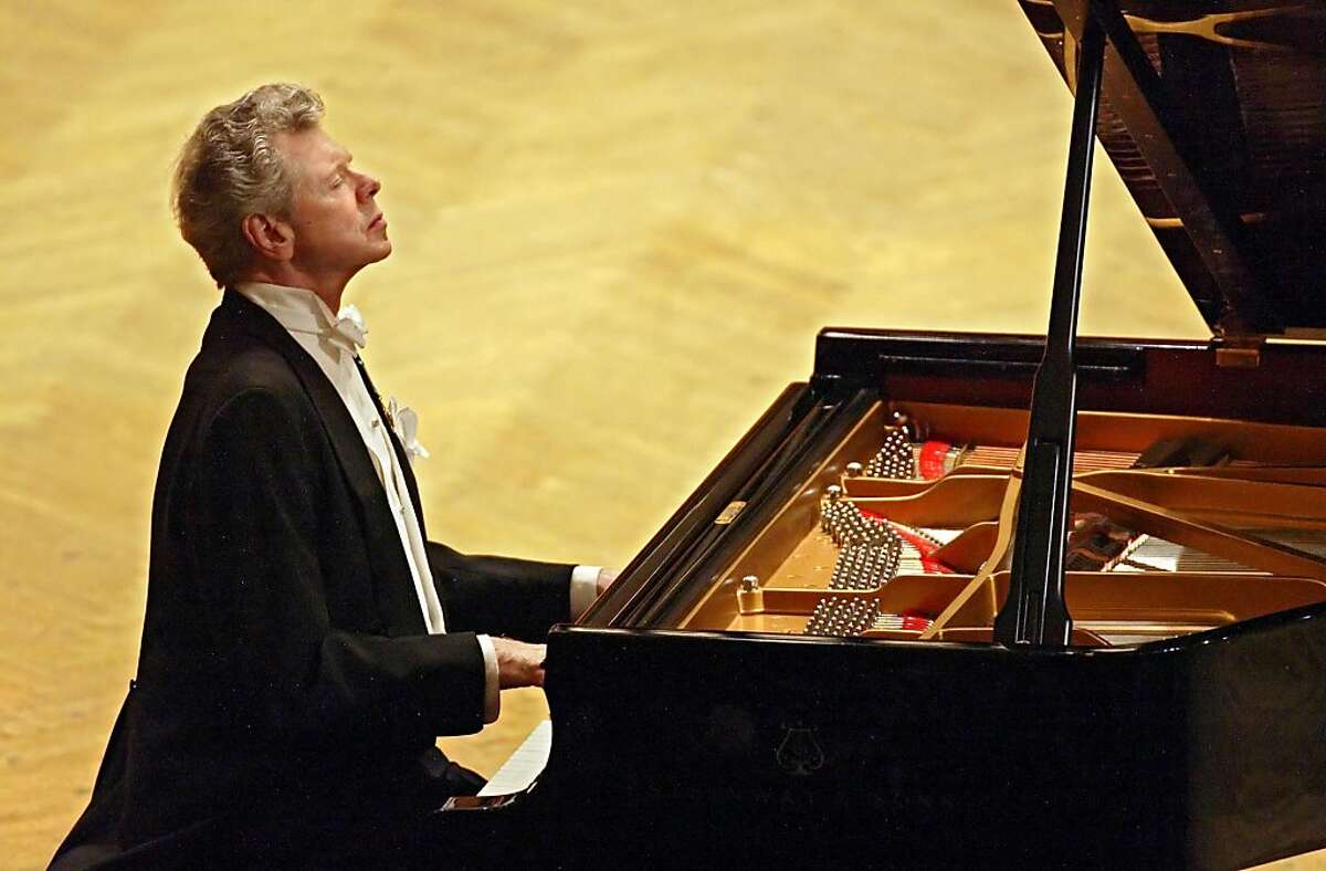 This Sept. 21, 2004 file photo shows pianist Van Cliburn performing during at a concert dedicated to the memory of the victims of the recent Beslan school massacre in Moscow. Cliburn, the internationally celebrated pianist whose triumph at a 1958 Moscow competition helped thaw the Cold War and launched a spectacular career that made him the rare classical musician to enjoy rock star status died early Wednesday, Feb. 27, 2013, at his Fort Worth home following a battle with bone cancer. He was 78.