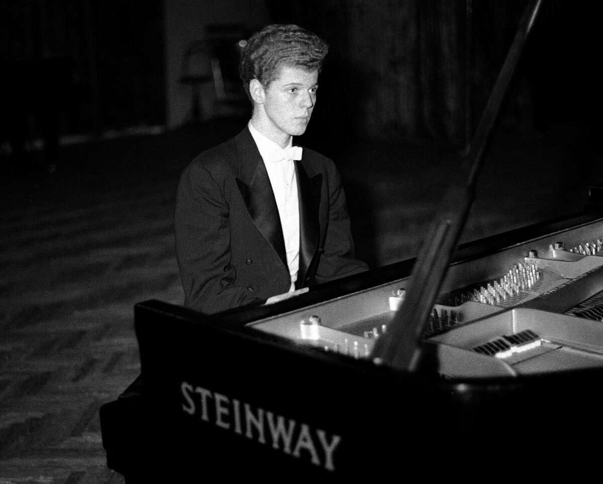 FILE - This April 11, 1958 file photo shows pianist Van Cliburn performing in final round of Tchaikovsky International Piano & Violin competition in Moscow. Cliburn, the internationally celebrated pianist whose triumph at a 1958 Moscow competition helped thaw the Cold War and launched a spectacular career that made him the rare classical musician to enjoy rock star status died early Wednesday, Feb. 27, 2013, at his Fort Worth home following a battle with bone cancer. He was 78. (AP Photo, file)