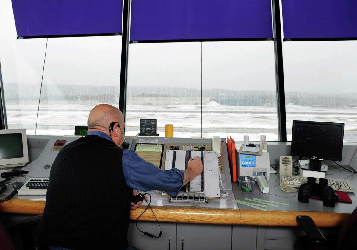 An air traffic controller works at Waterbury-Oxford Airport in Oxford, Conn. Wednesday, Feb. 27, 2013. The Federal Aviation Administration (FAA) will begin furloughing air traffic controllers March 1 because of looming automatic spending cuts which will affect six airports in Connecticut and about 190 airports nationwide.