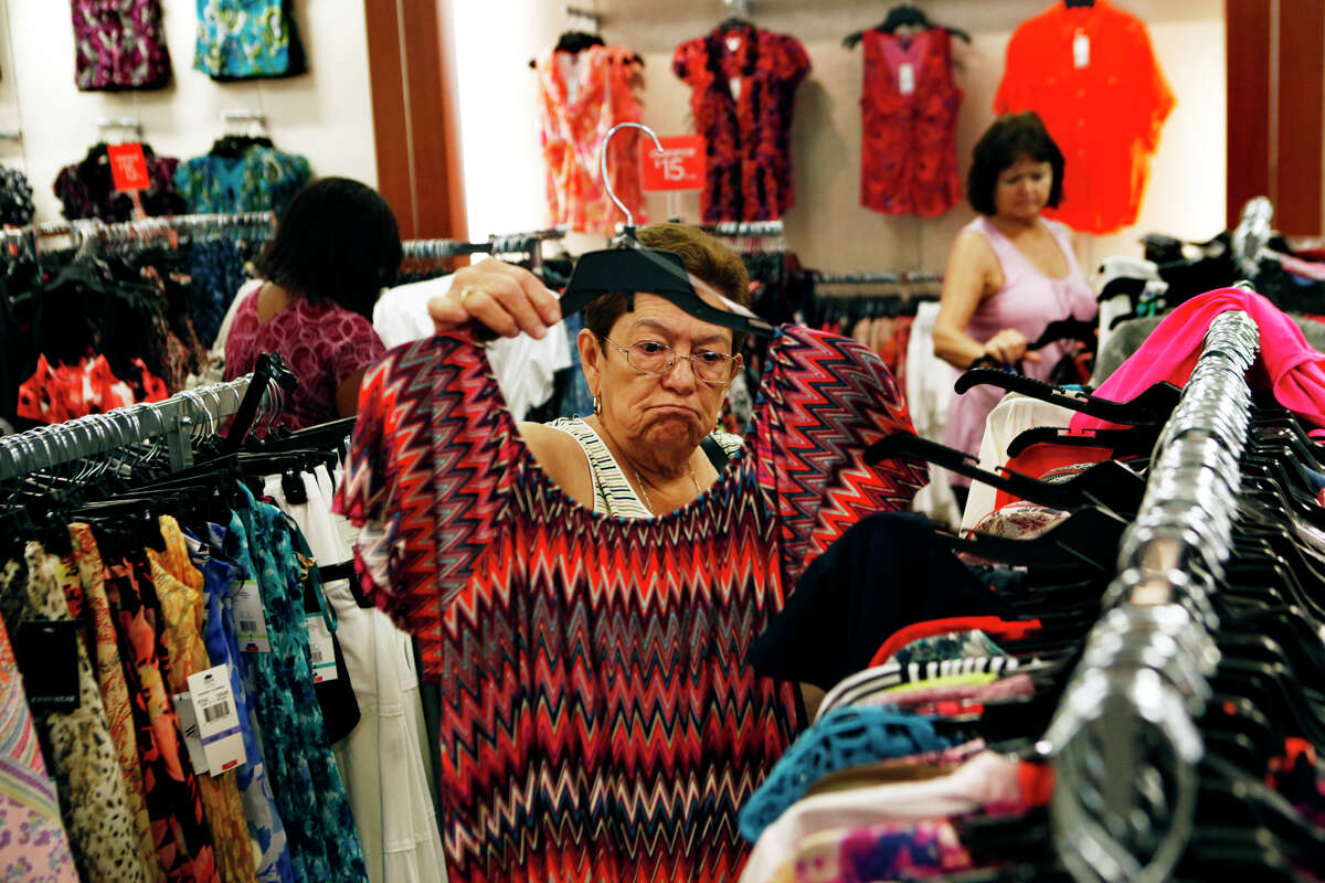 FILE - In this Friday, July 27, 2012, file photo, Teresa Chavez shops at JC Penney's in the Southaven Towne Center Mall in Southaven, Miss. On Thursday, Feb. 28, 2013, a day after J.C. Penney reported a much wider-than-expected loss, the retailer?s stock is plummeting. (AP Photo/The Commercial Appeal, Kyle Kurlick, File)