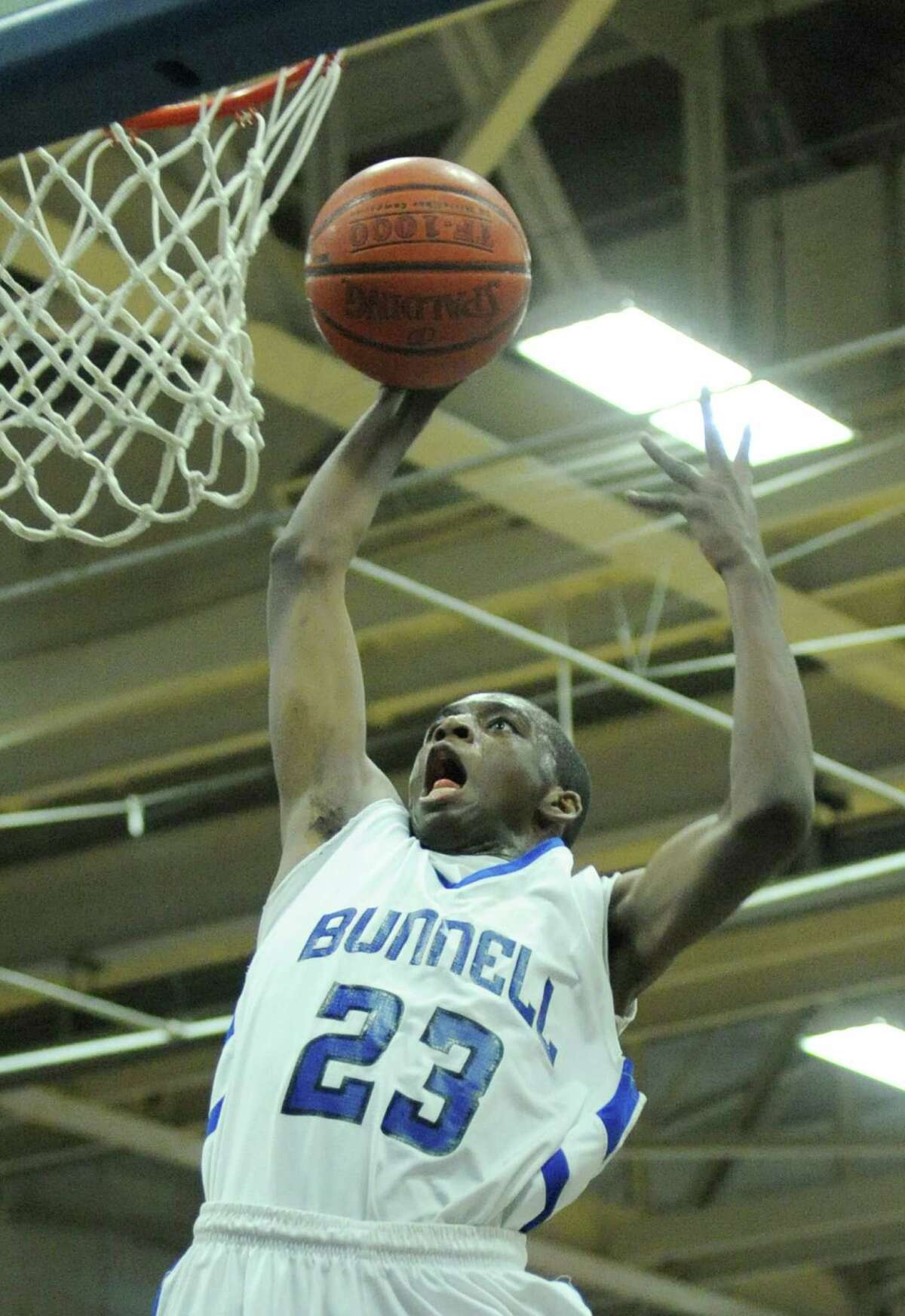 Bunnell's Issac Vann slam dunks during Bunnell's 71-61 win in the SWC Boys Basketball Championship game at Bunnell High School in Stratford, Conn. Thursday, Feb. 28, 2013.
