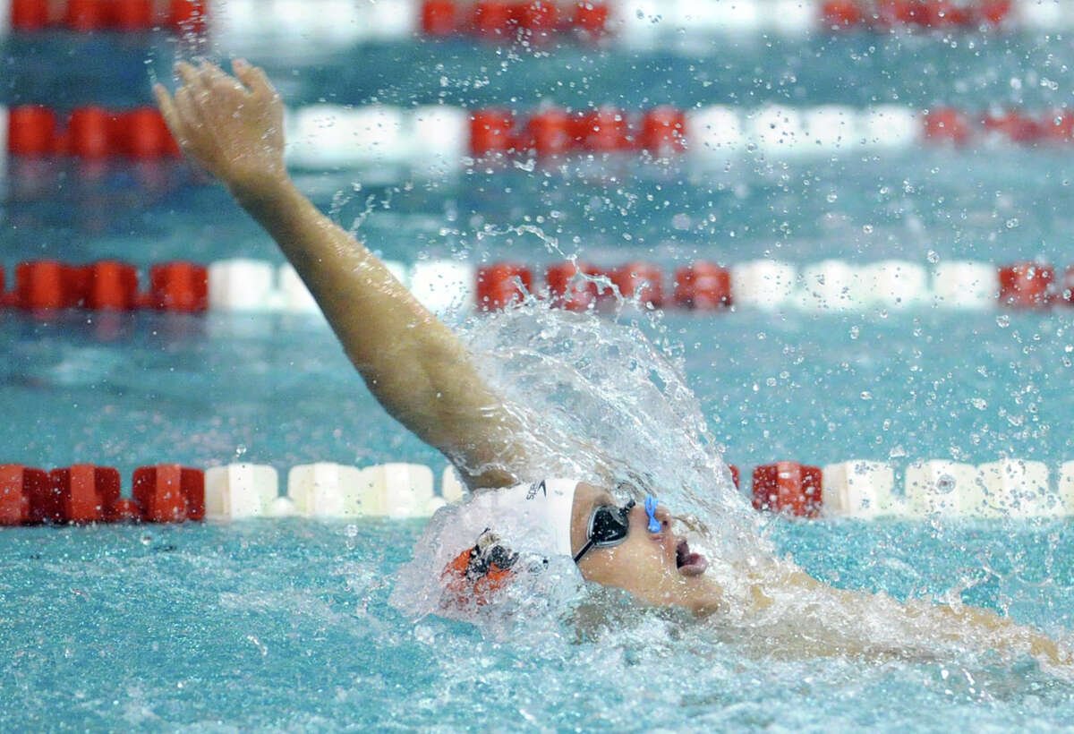 Alex Lewis of Greenwich High School swims the backstroke leg during the 200 medley relay event that Greenwich won during the FCIAC Swimming championships at Greenwich High School, Thursday night, Feb. 28, 2013.