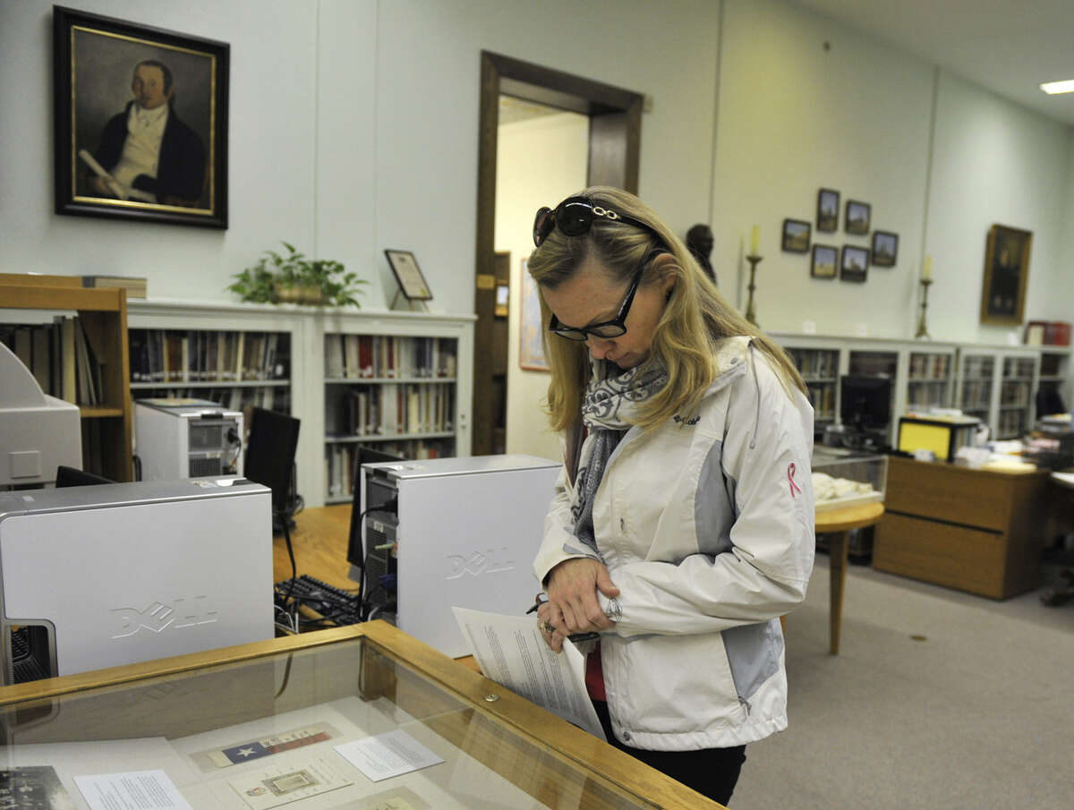 Rosie McCooe, a visitor from Ridgewood, N.J., looks over a display inside the DRT Library.