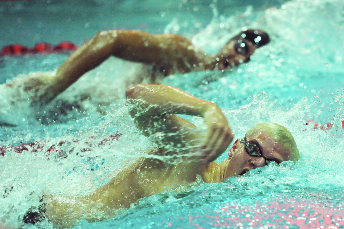 Pomperaug's Nathan Zabarsky, bottom, battles Brookfield's Luciano Souza in the mixed 100-yard freestyle at the SWC boys swimming championship at Masuk High School in Monroe, Conn. Friday, March 1, 2013. Souza finished first with a time of 48.02 seconds and Zabarsky finished second.