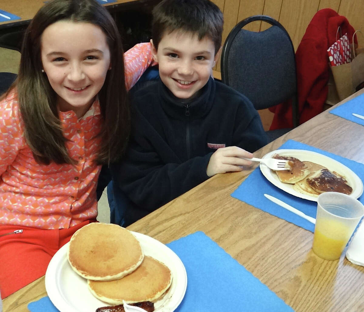 Sadie Bernstein and Hudson Houghton, both 9, of Fairfield, are all smiles at the Fairfield Masonic Lodge annual pancake breakfast fundraiser on Saturday. FAIRFIELD CITIZEN, CT 3/2/13