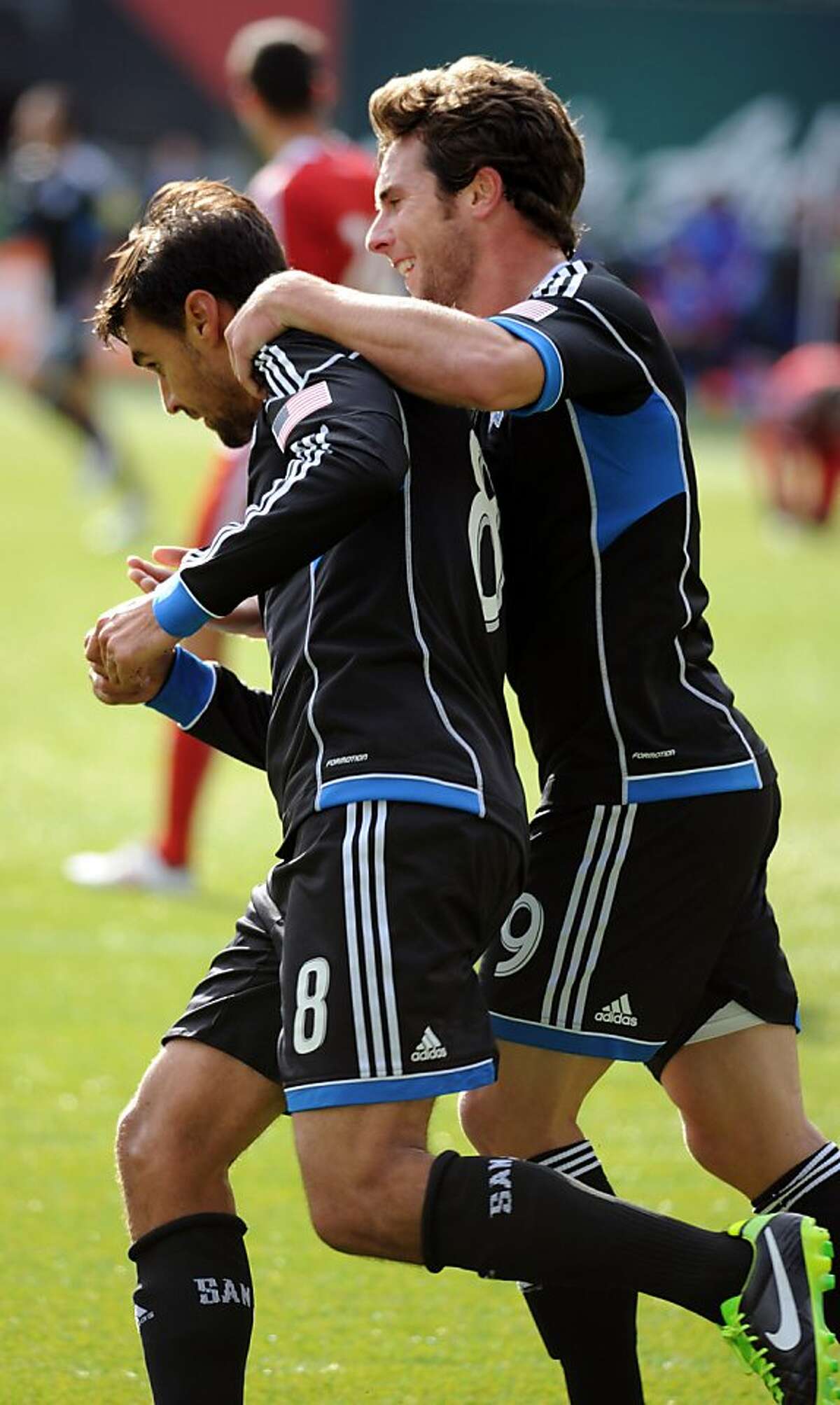 PORTLAND, OR - FEBRUARY 23: Chris Wondolowski #8 of San Jose Earthquakes celebrates with Mike Fucito #9 of San Jose Earthquakes after scoring a goal during the first half of the game against the FC Dallas at Jeld-Wen Field on February 23, 2013 in Portland, Oregon. (Photo by Steve Dykes/Getty Images)