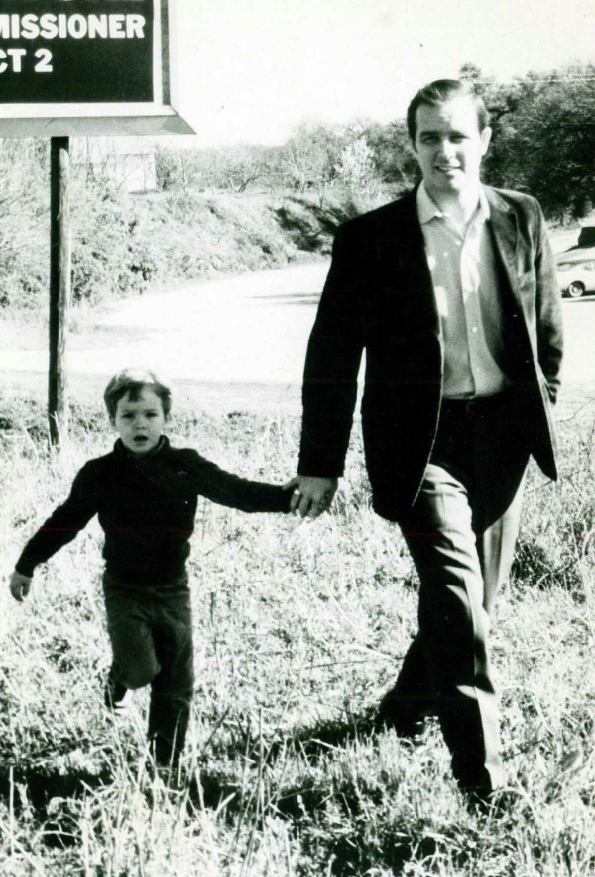 Nelson Wolff, then in the Texas Legislature, walks with son Kevin in the early 1970s.