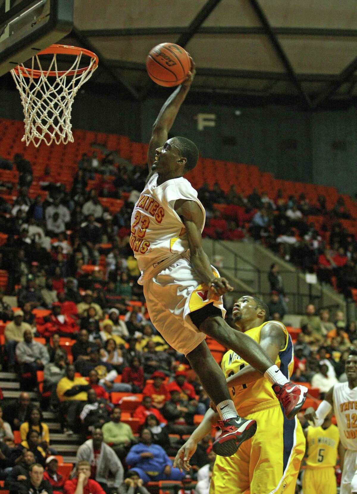 Yates (31-4) advances to the state tournament for the third year in a row and fifth time in six years thanks to dunks like this from Darrion Martin against La Marque. (Photo: Eric Christian Smith: For the Houston Chronicle)
