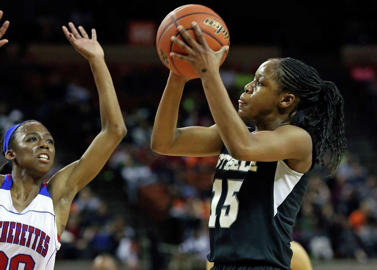 Kyra Lambert takes a shot before Tasia Foman can get to her as Steele plays Duncanville in the state championship game at the Erwin Center on March, 2013.