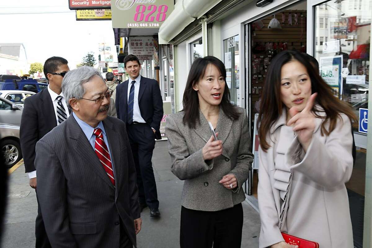 San Francisco Mayor Ed Lee, left, and new supervisor Katy Tang, right, speak with Caroline Yee, center as they took a walk along Irving Street to meet merchants on Thursday, February 28, 2013, in San Francisco, Calif,.