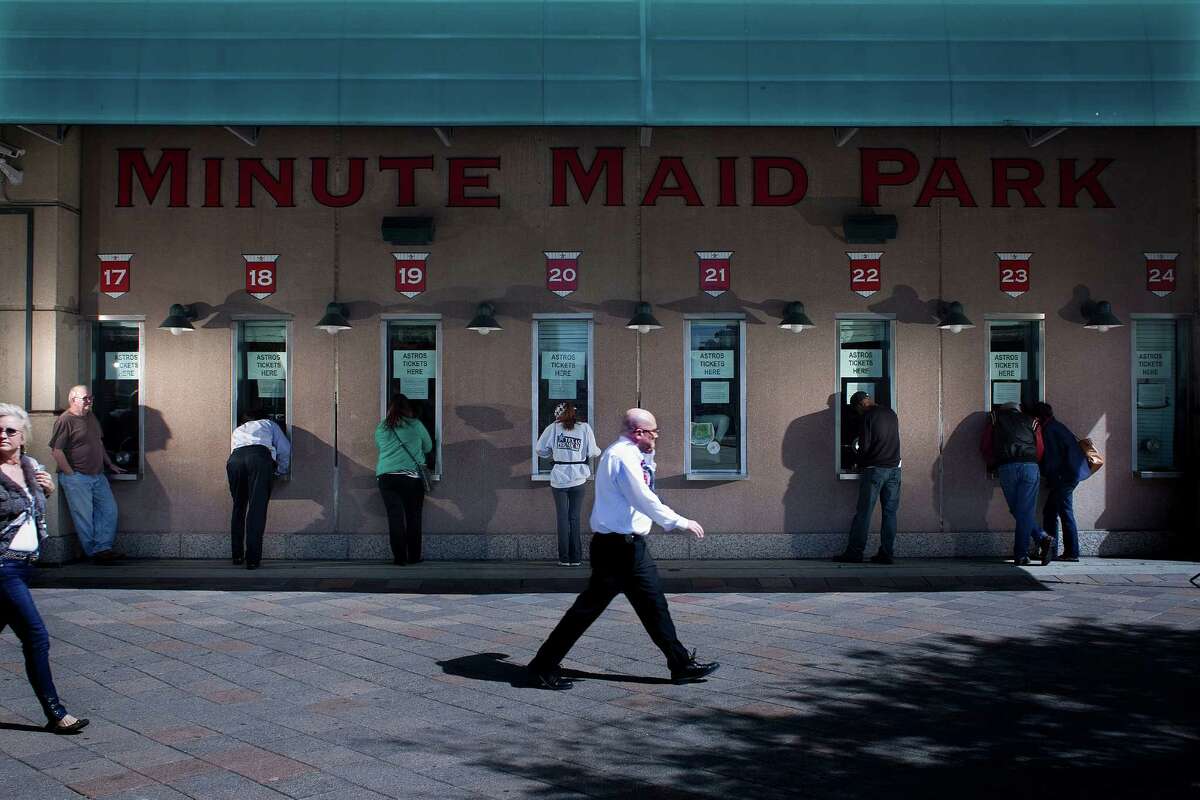 Fans lineup at ticket booths outside of Minute Maid Park on 700 Texas as the Astros single-game tickets went on sale Sunday, March 3, 2013, in Houston.