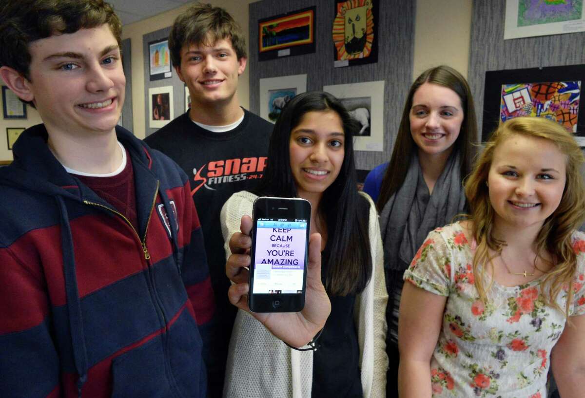 Students at Shaker High, from left, Daniel LaSalle, Kyle Fragnoli, Anum Hussain, Katie McLean and Stephanie Morgan discuss a new Facebook page called Shaker Compliments, where students post praise for each other. Part of a national trend, Shaker's site has inspired at least two others at Shenendehowa and Emma Willard. (John Carl D'Annibale / Times Union)