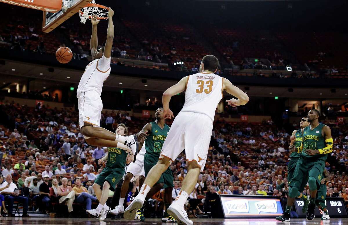 Texas freshman Cameron Ridley, who had a timely assist late in the game, scores two of his eight points the easy way in the first half Monday night.