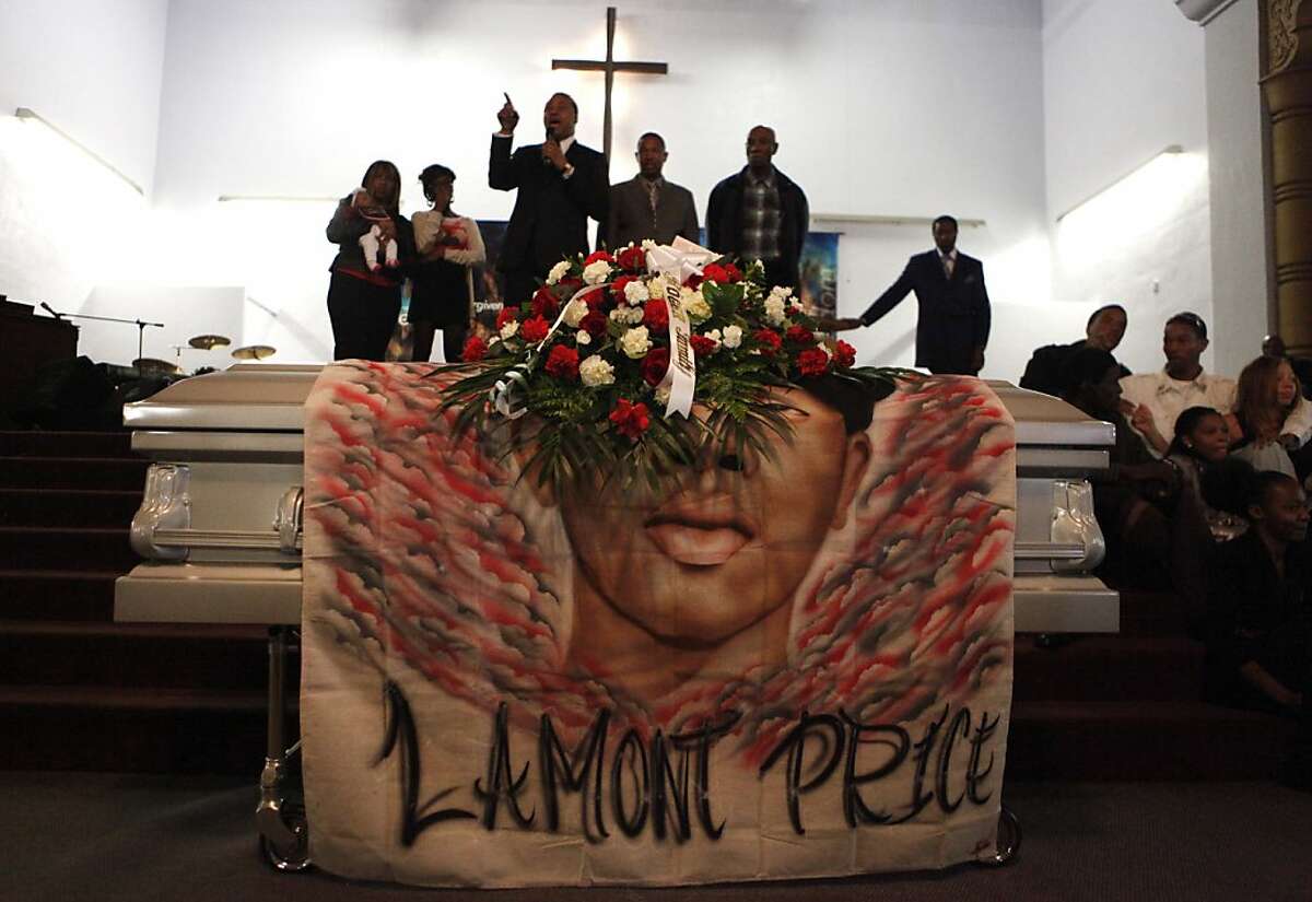 Pastor Harry Fort stands among the family members of Lamont Price during the funeral for the 17-year-old boy, Wednesday February 29, 2012, at the Mt. Calvary Missionary Baptist Church in Oakland.